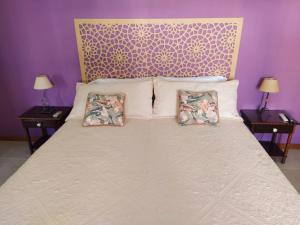 מיטה או מיטות בחדר ב-Cataratas alquiler temporario