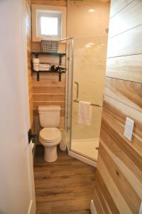 a small bathroom with a toilet and a shower at Escalante Escapes Tumble Weed- Bunk Escape in Escalante
