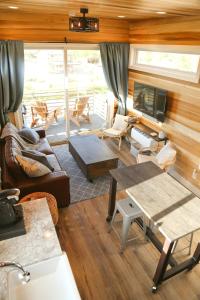 a living room with a couch and a table at Escalante Escapes Star Lily- Bunk Escape in Escalante