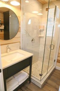 a bathroom with a sink and a shower at Escalante Escapes Wild Rose- King Escape in Escalante