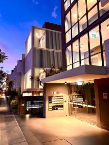 a large building with a lot of windows at Luxury 1 BR Apartment in Randwick- Walk to hospital UNSW Dining W parking and lift and AC in Sydney