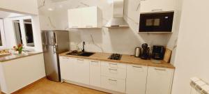 Kuchyň nebo kuchyňský kout v ubytování Apartmani Cupar