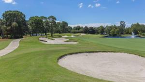 a golf course with a sand bunker on a green at Bungalos 2441 in Destin