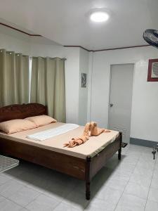 Postel nebo postele na pokoji v ubytování Em's Homestay
