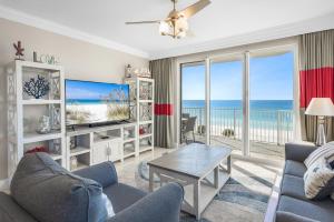 a living room with a view of the ocean at Majestic Sun 414B in Destin