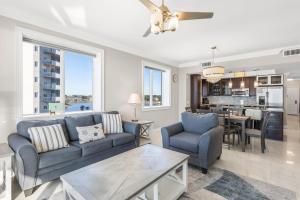 a living room with a couch and a table at Majestic Sun 414B in Destin