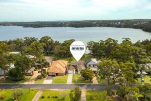 an aerial view of a house with a large white balloon at Aqua by Experience Jervis Bay in Sanctuary Point +12 photos