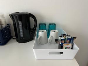 a white tray with some cups and a blender at The Dome in London