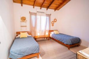 Rúm í herbergi á Curiol Boutique Hotel & Lounge