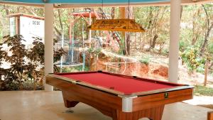 a pool table sitting inside of a room with a ceiling at Hotel Sol y Mar in Santa Catalina