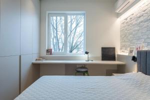 Postel nebo postele na pokoji v ubytování Modern & Stylish Sea Apartment with Parking + 11 fotografií