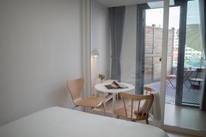Cama o camas de una habitación en Urbanstay Myeongdong