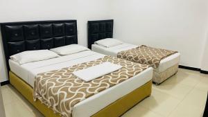 Postel nebo postele na pokoji v ubytování Saasha City Hotel + 35 fotografií