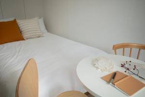 Cama o camas de una habitación en Urbanstay Myeongdong