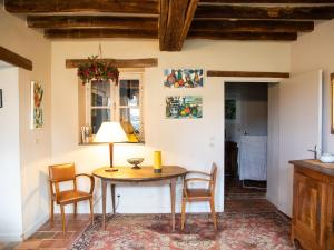 a dining room with a table and chairs at Gîte paisible pour 6 pers. près du zoo de la Flèche, avec jardin, barbecue et WiFi - FR-1-410-126 in Mareil-sur-Loir