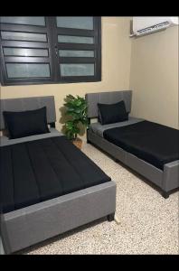 Ein Bett oder Betten in einem Zimmer der Unterkunft The Olive House PR