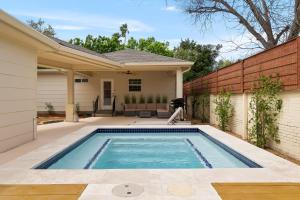 a swimming pool in the backyard of a house at Charming Home in Downtown McAllen in McAllen