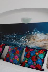 Ένα ή περισσότερα κρεβάτια σε δωμάτιο στο Casa Galeria Beach Front