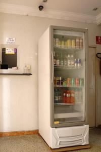 a refrigerator with its door open in a room at Hotel city Clélia in São Paulo +57 photos