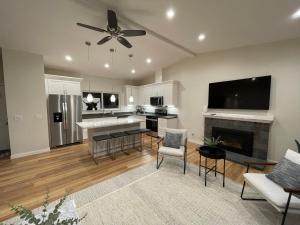 a kitchen and living room with a ceiling fan at Bright Napa Home in Napa