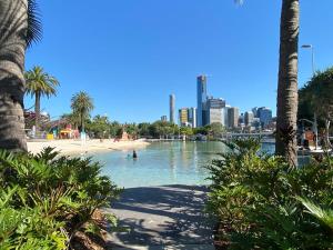 a body of water with a city in the background at TASTE of African Luxury in the Heart of Brisbane in Brisbane