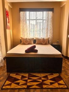Postel nebo postele na pokoji v ubytování Sai Darshan Homestay
