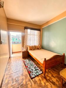 Postel nebo postele na pokoji v ubytování Sai Darshan Homestay
