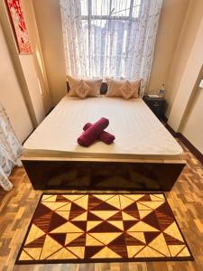 Postel nebo postele na pokoji v ubytování Sai Darshan Homestay