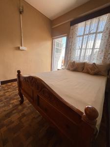 Postel nebo postele na pokoji v ubytování Sai Darshan Homestay