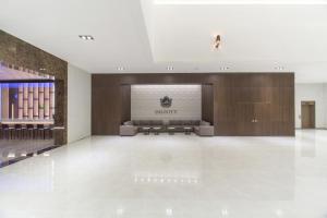 a lobby of a luxury hotel with a waiting room at Dignity Hotel in Yangyang