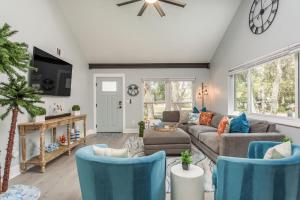 a living room with a couch and chairs at Luxury Family Beach Escape with Heated Pool and Putting Green in Tarpon Springs
