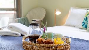 a basket of food and drinks on a table at Bombo Blue in Kiama +25 photos