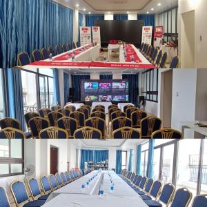 a meeting room with a long table and chairs at Glory Hotel Apartment Hải Phòng in Hai Phong