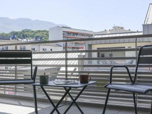 two chairs and a table on a balcony at Appartement Aix-les-Bains, 3 pièces, 6 personnes - FR-1-617-30 in Aix-les-Bains