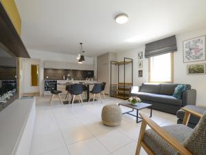 a living room with a couch and a table at Appartement Aix-les-Bains, 3 pièces, 6 personnes - FR-1-617-30 in Aix-les-Bains