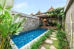 a swimming pool in the backyard of a house at ME Villas Echo Beach Canggu in Canggu