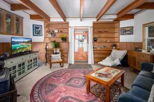 a living room with a couch and a tv at The Gingerbread Cottage in Kings Beach