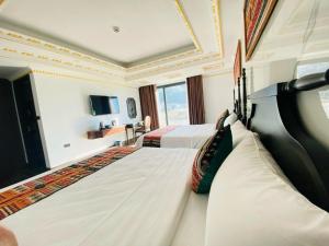 Postel nebo postele na pokoji v ubytování Trung Huyền Hotel