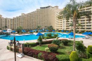 a large hotel with a large pool and a resort at Porto Sokhna Hotel in Ain Sokhna