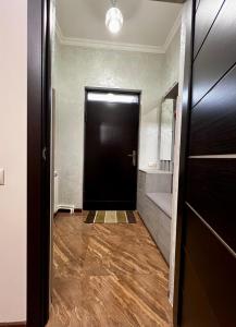 a hallway with a black door in a room at New , comfortable 3 bedroom house in Yerevan