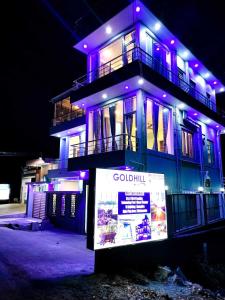 a building with purple lights on top of it at Yelagiri GoldHill Resort in Yelagiri