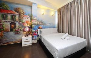 Postel nebo postele na pokoji v ubytování Seeds Hotel Shah Alam Seksyen 7 I-City