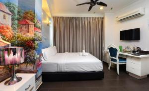 Postel nebo postele na pokoji v ubytování Seeds Hotel Shah Alam Seksyen 7 I-City