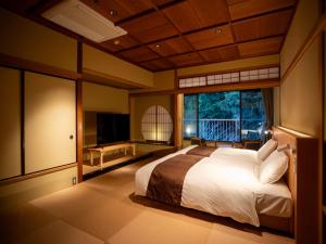 Postel nebo postele na pokoji v ubytování Hakone Pax Yoshino