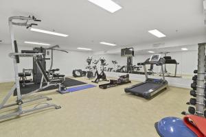 a gym with several treadmills and tread machines at Cotton Beach 8 Escape With Private Plunge Pool in Casuarina