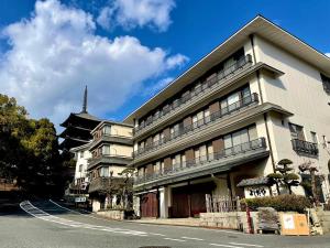 a large building on the side of a street at Yoshidaya Ryokan よしだや in Nara