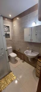 a bathroom with a toilet and a sink at Apartman Princess 148a in Hurghada
