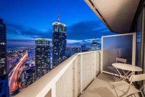a balcony with a view of a city at night at Presidential Suite Heart of Downtown with Stunning View in Toronto