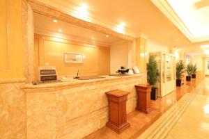 a lobby with a reception counter in a building at Hotel Fine Garden Toyonaka Osaka International Itami Airport in Toyonaka