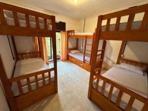 Postel nebo postele na pokoji v ubytování Rodin Bali Hostel